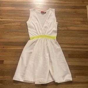 White dress with yellow around the waist